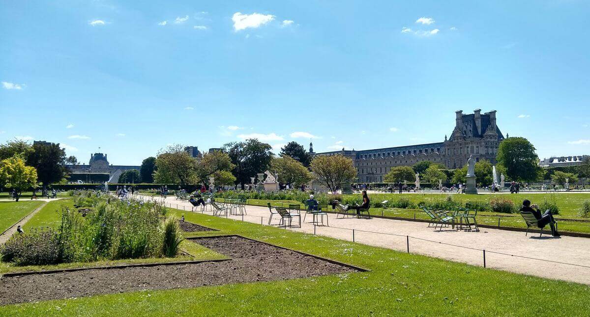 Les Jardin des Tuileries with view of the Louvre and the Louvre pyramid in the background.