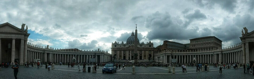 Panorama of St. Peter's Square in Vatican City with storm sky