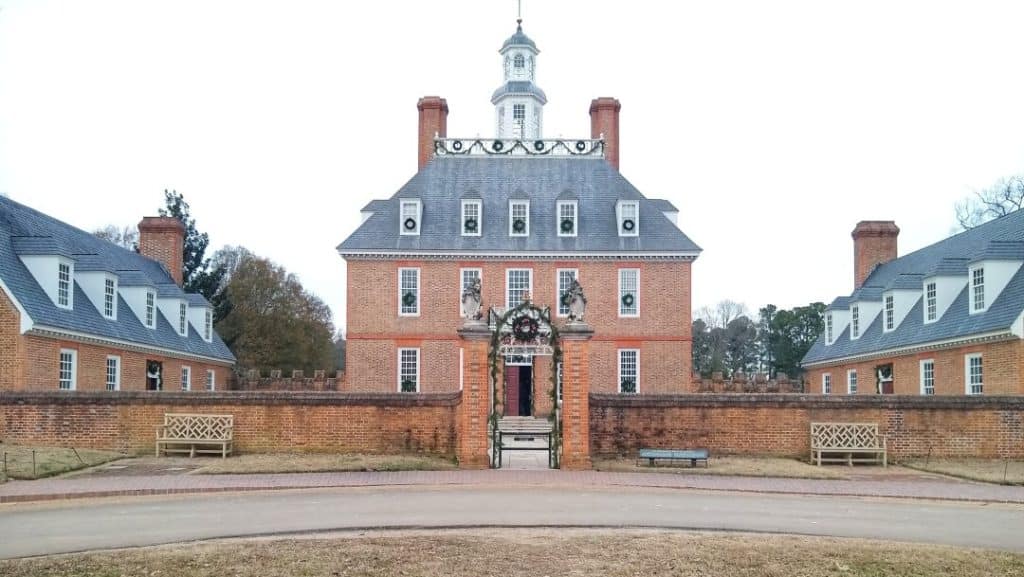 Governor's Palace in Colonial Williamsburg with Christmas garlands on the front gate.