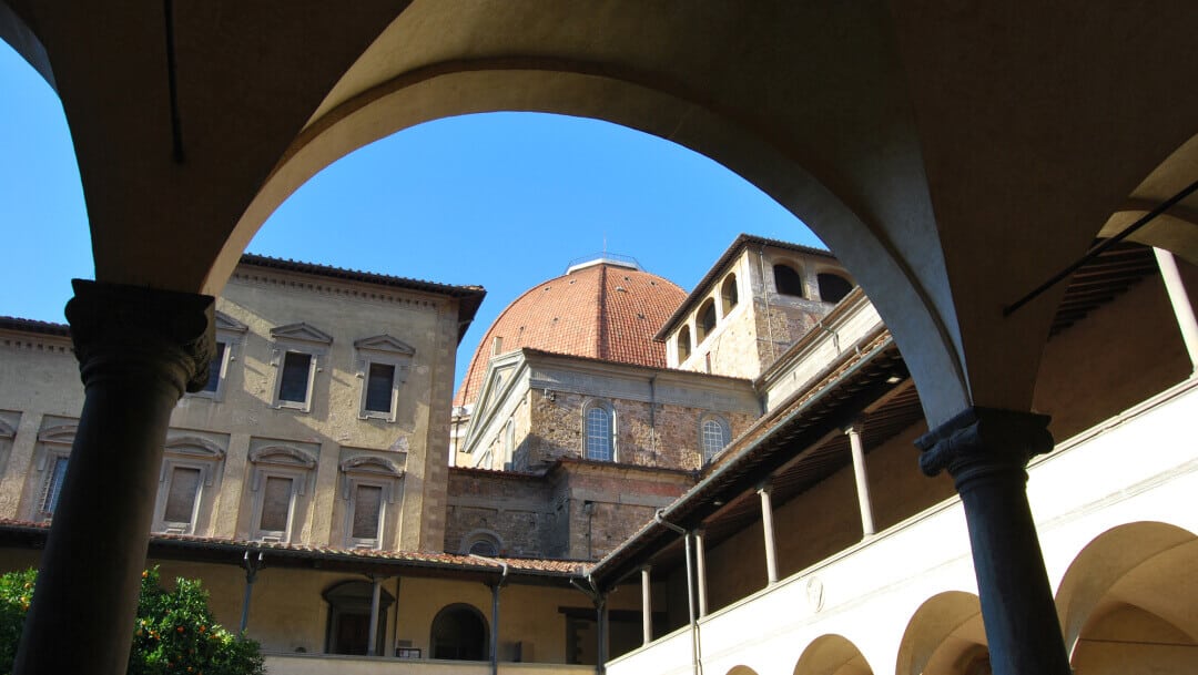 The red tile dome of San Lorenzo visible from the church cloister