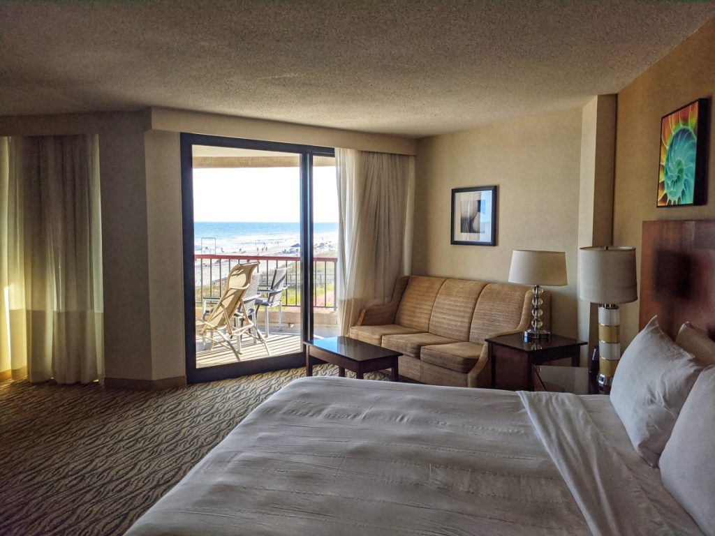 Hotel room with a balcony overlooking the beach