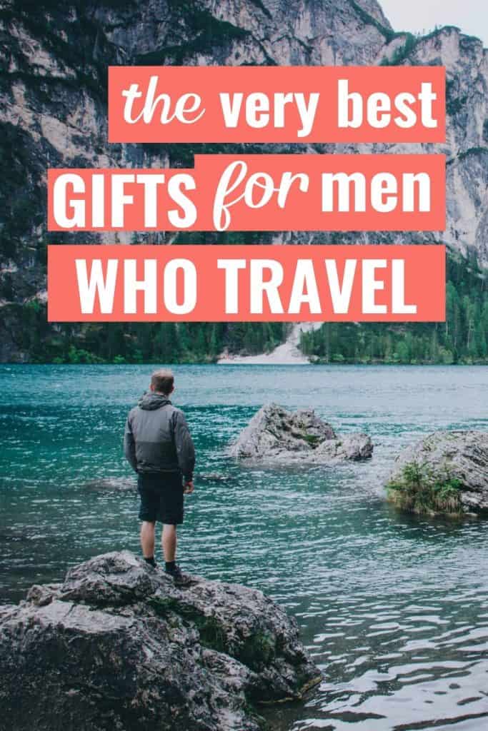 Hiker enjoying a beautiful view of a lake in Italy with a text overlay about the best travel gifts for men.