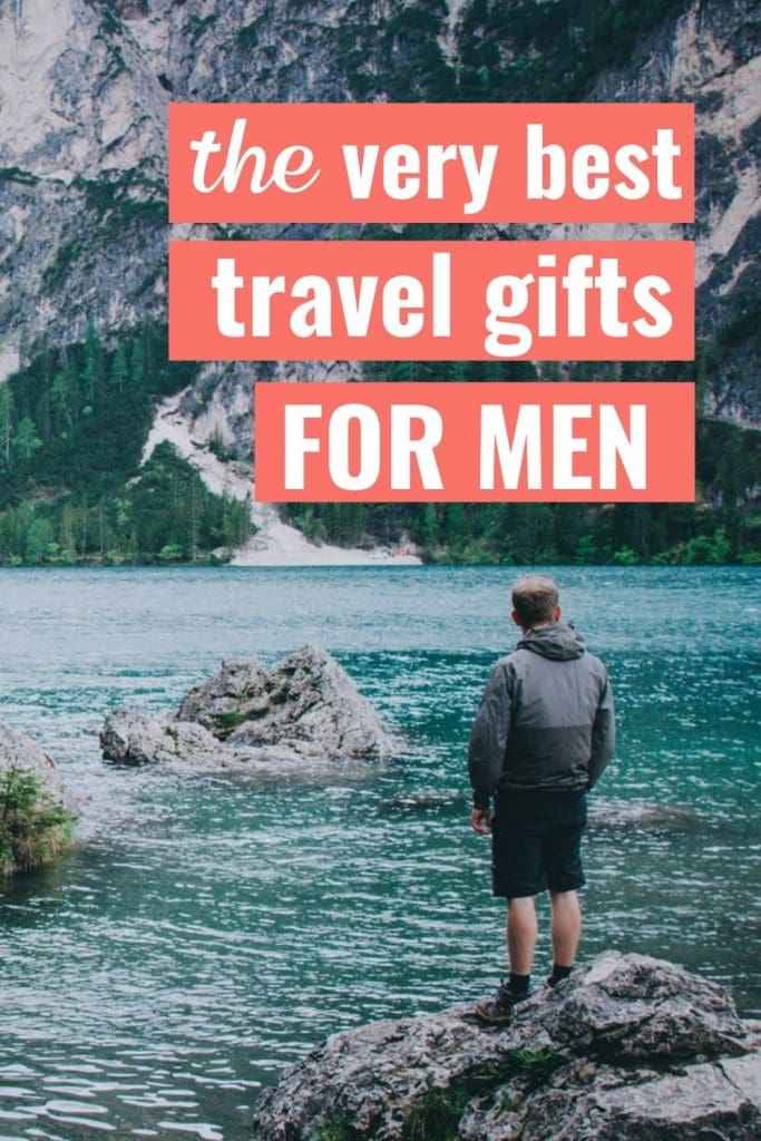 Hiker enjoying a beautiful view of a lake in Italy with a text overlay about the best travel gifts for men.