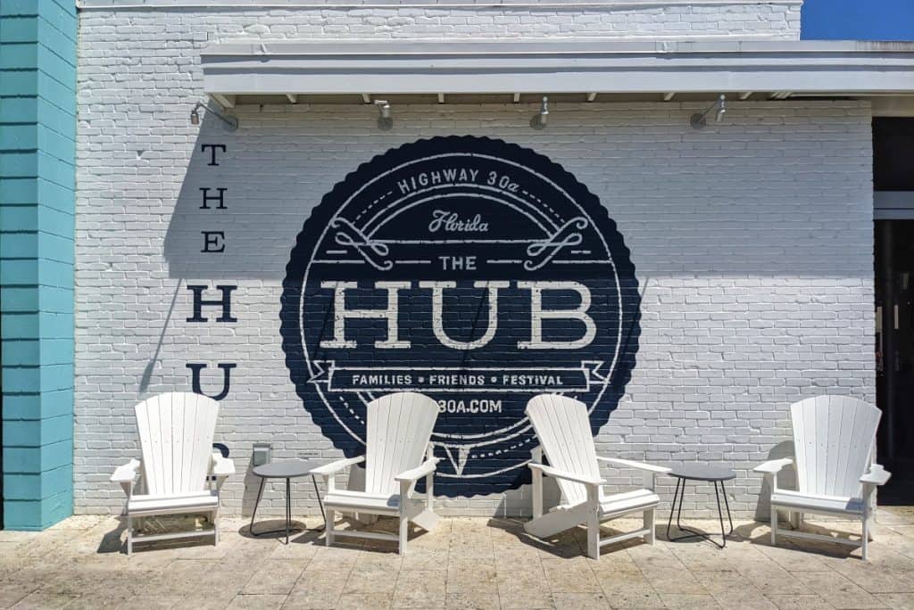 painted sign for The Hub on a brick wall on Highway 30A