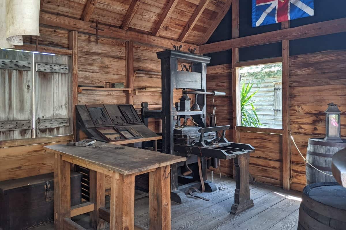 old printing press inside an old wooden building at the Colonial Quarter