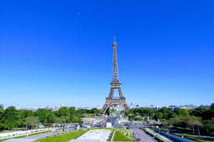 view of the Eiffel Tower with a bright blue sky