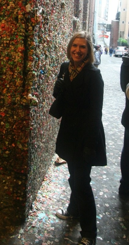 the author posing by the gum wall in Seattle