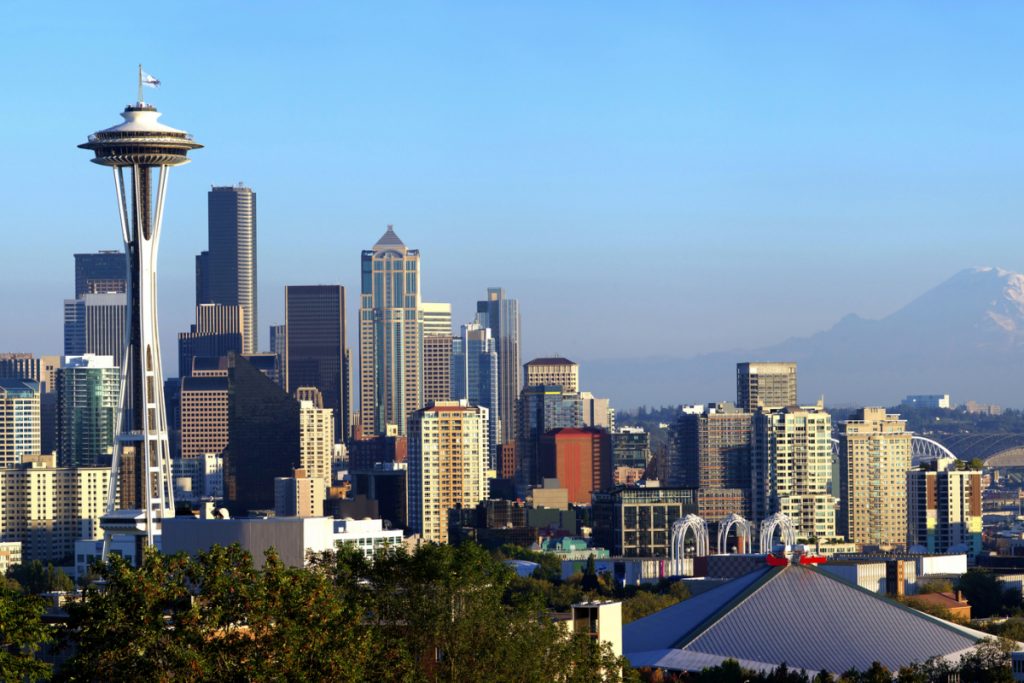 A panoramic view of Seattle Washington modern skyline buildings and mt. Rainier.