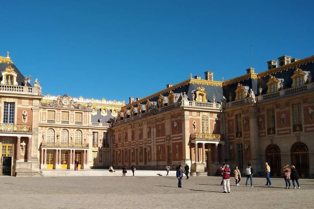 People in the royal courtyard at Versailles