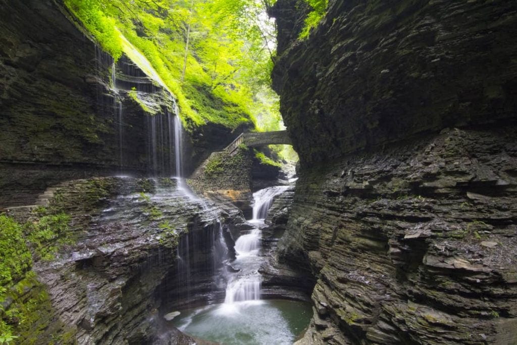waterfall cascading over a stone ledge in Watkins Glen State Park New York