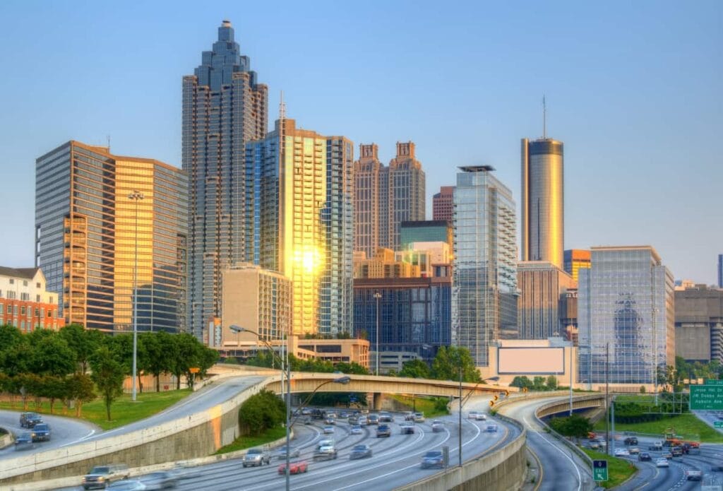 view of the downtown Atlanta, Georgia, skyline with cars on the freeway