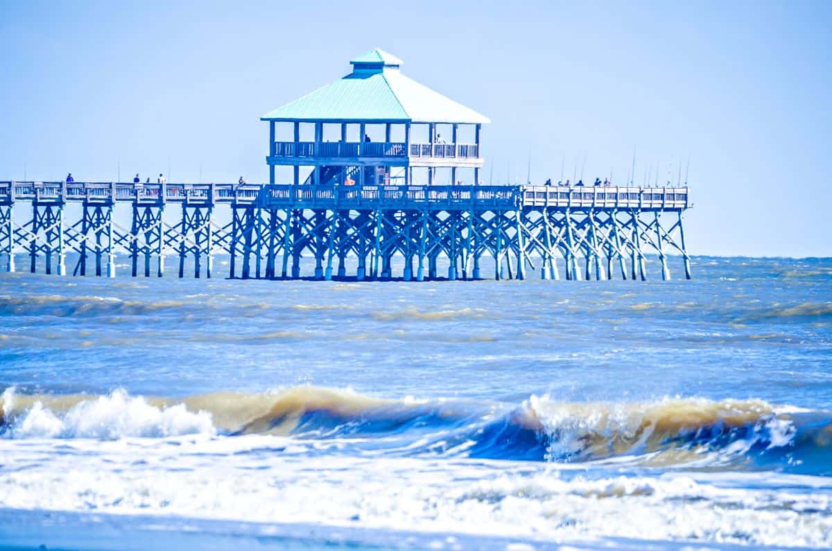 a long pier stretching out over the ocean