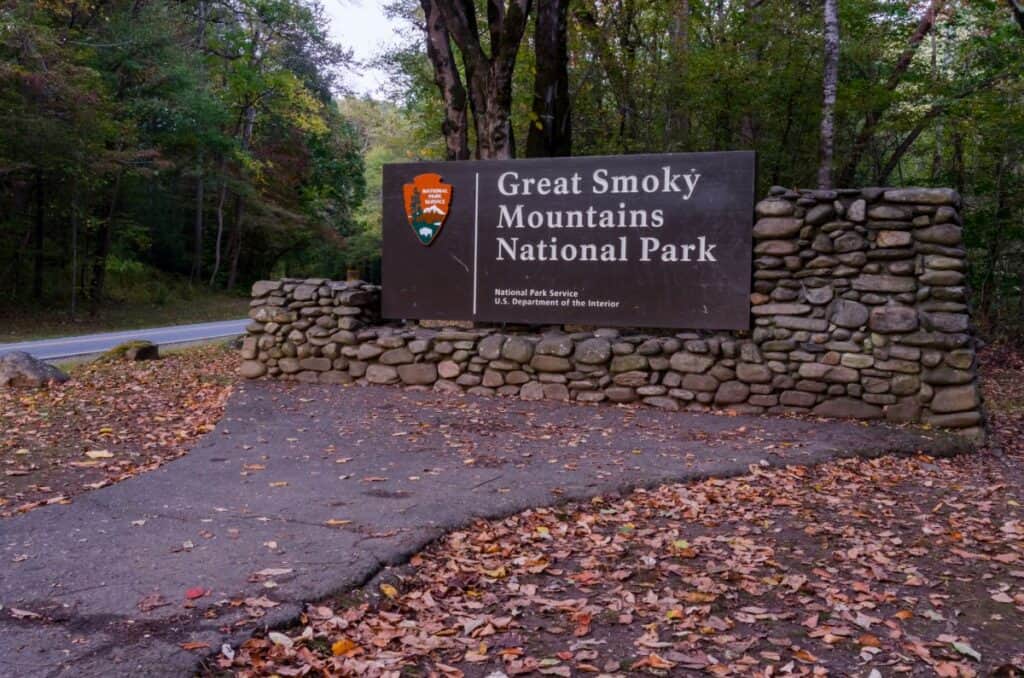 An entrance sign to the Great Smoky Mountains National Park in fall