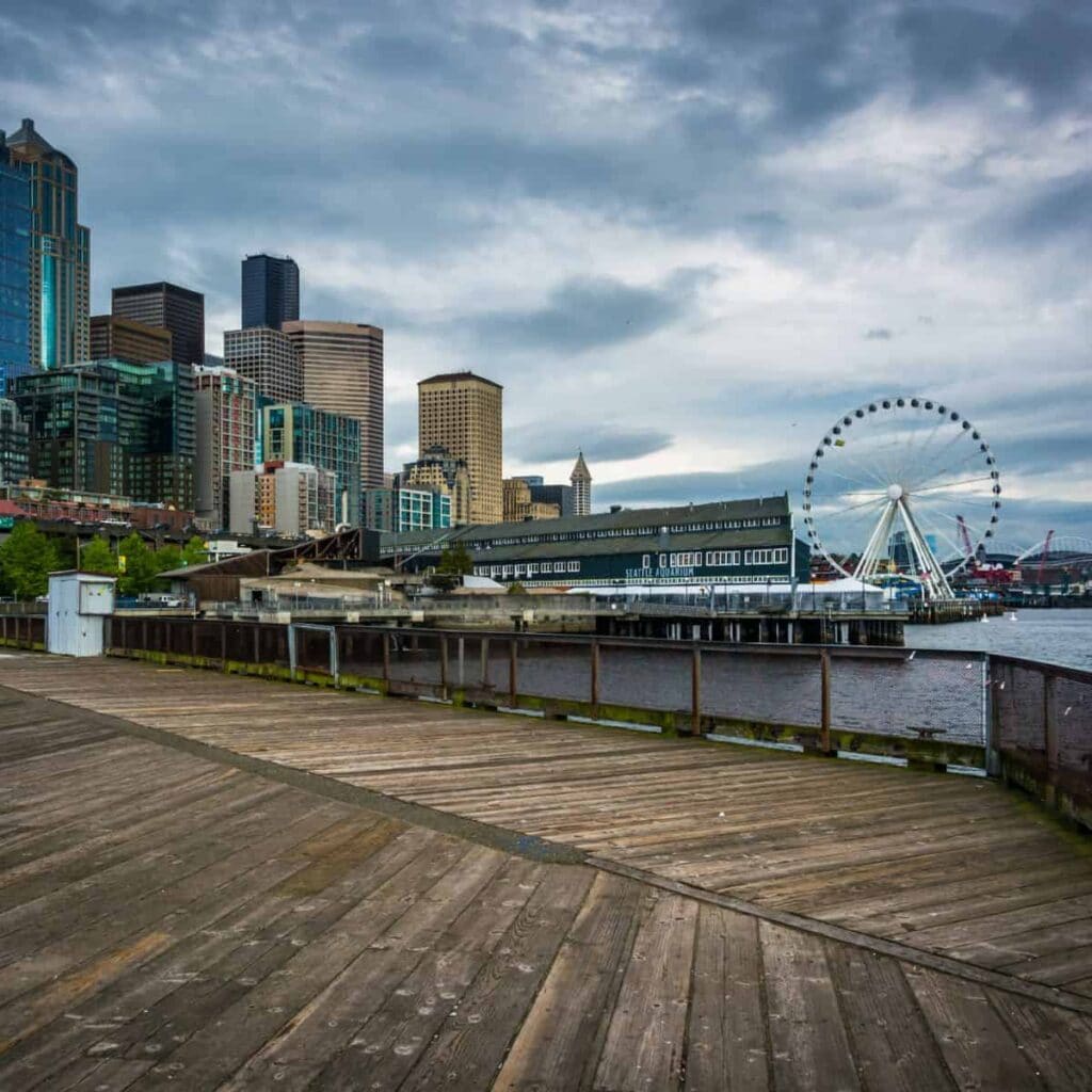 view of buildings and the Seattle Wheel from Pier 62 on the Seattle Waterfront