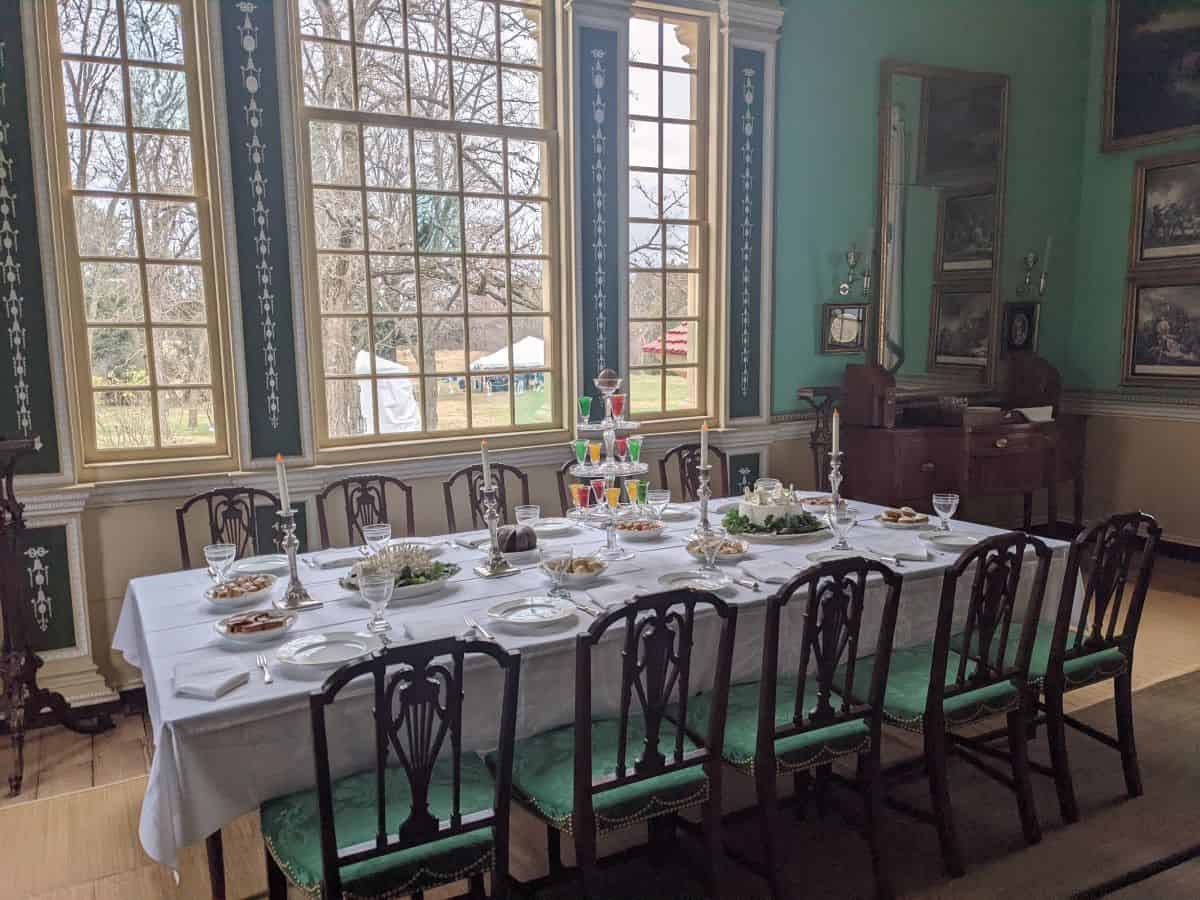 colonial era dining room including a set table with food