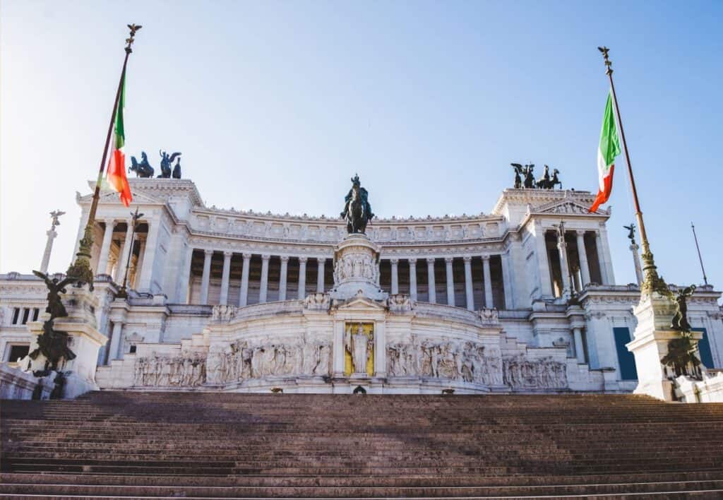 large statue of Victor Emmanuel II in front of large marble structure