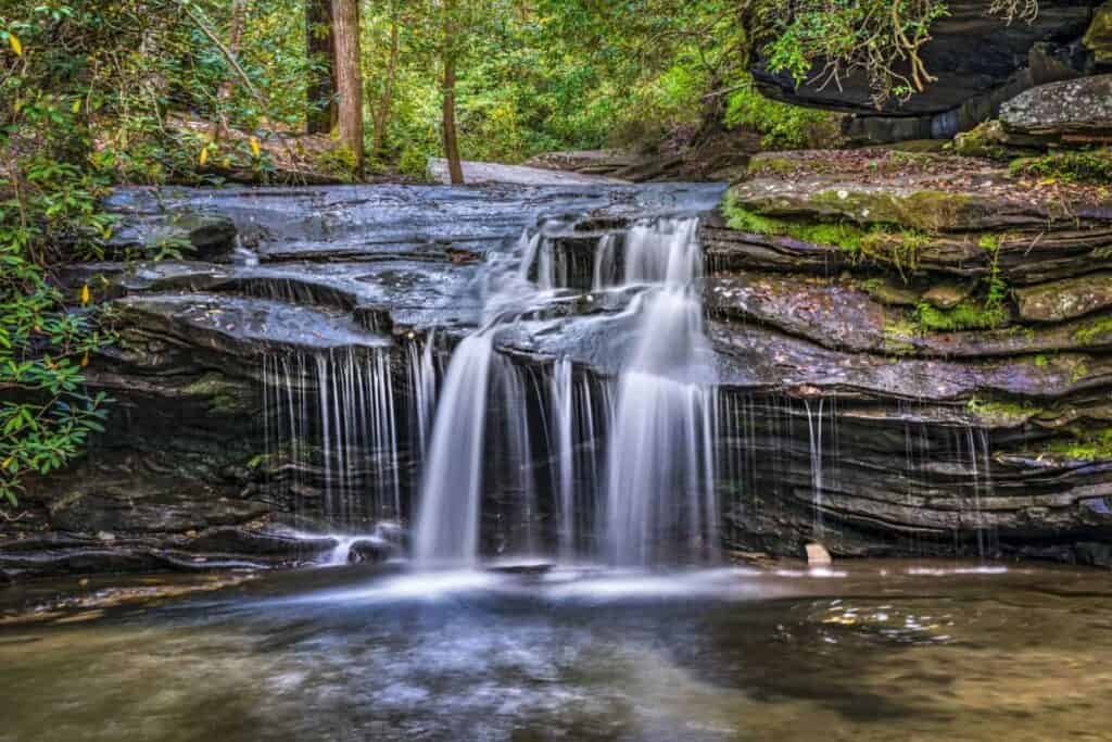 short waterfall over layered rocks in Table Rock State Park South Carolina