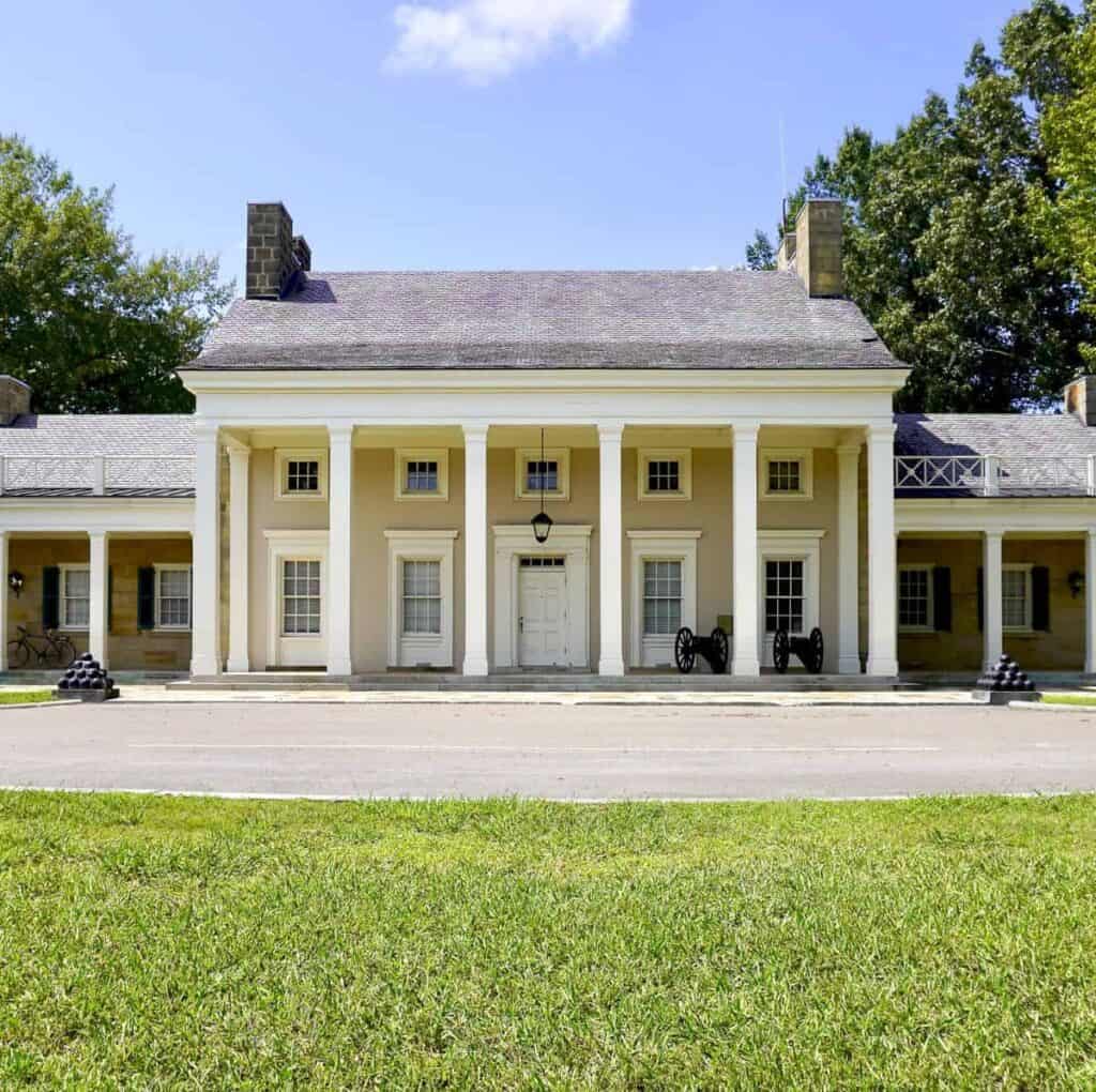 Mansion-style visitor center with white columns
