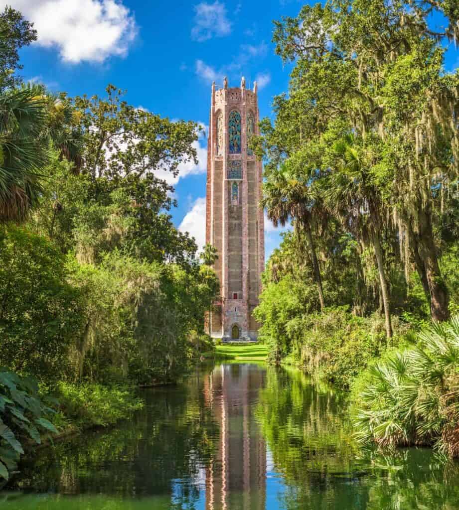 tall singing tower in the middle of a large botanical garden