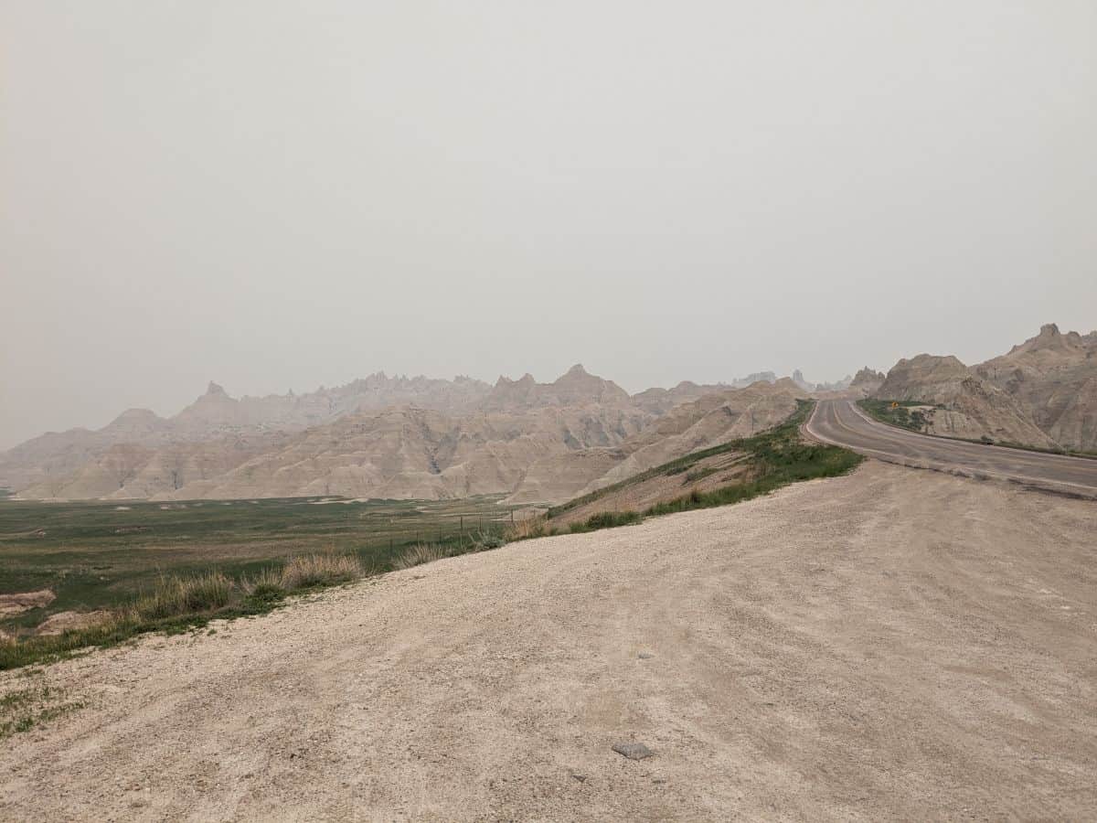 road winding through Badlands National Park and pointy rock formations