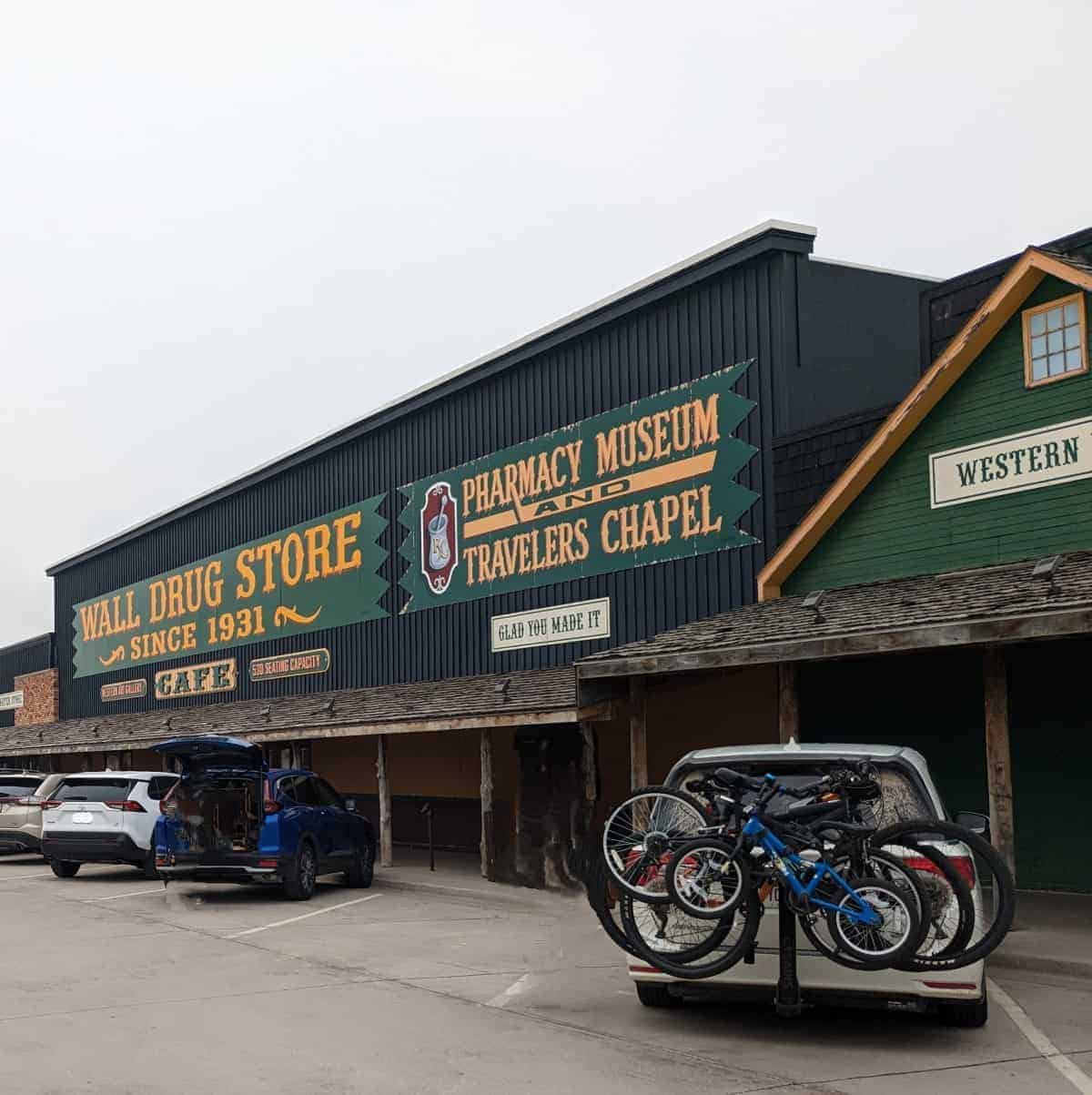 Large Western style storefront with a sign that says Wall Drug Store Since 1931.