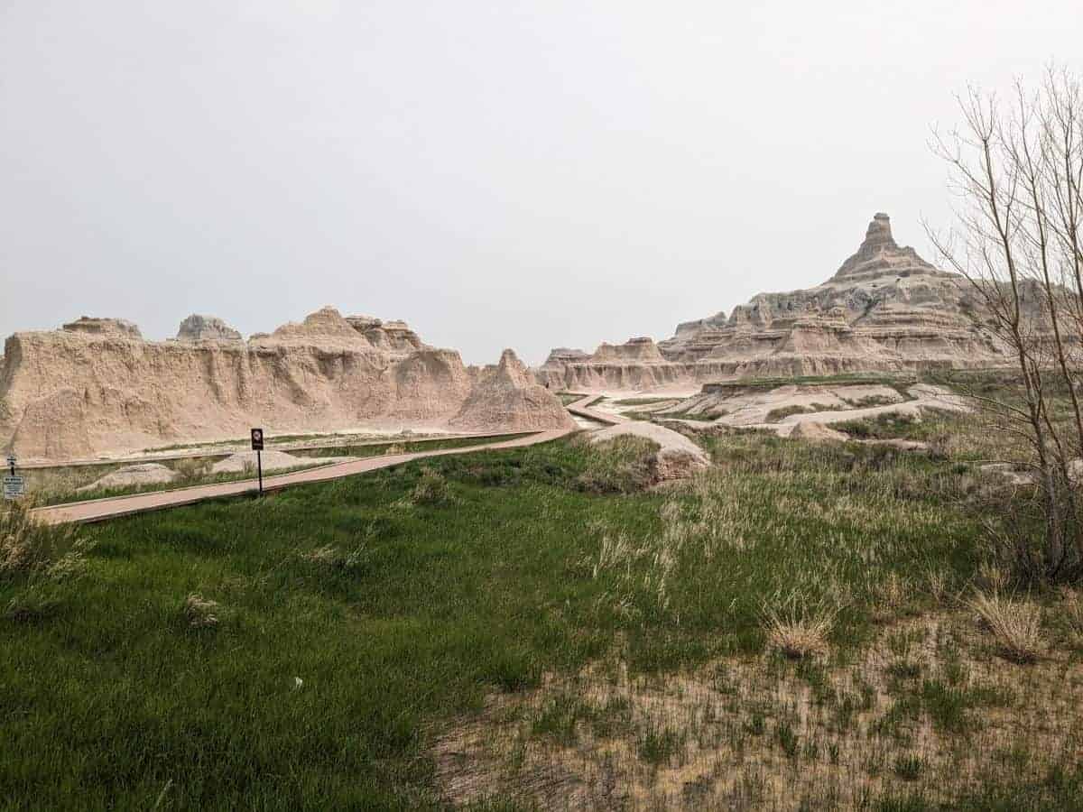 Boardwalk path over mixed grass prairie and through rock formations